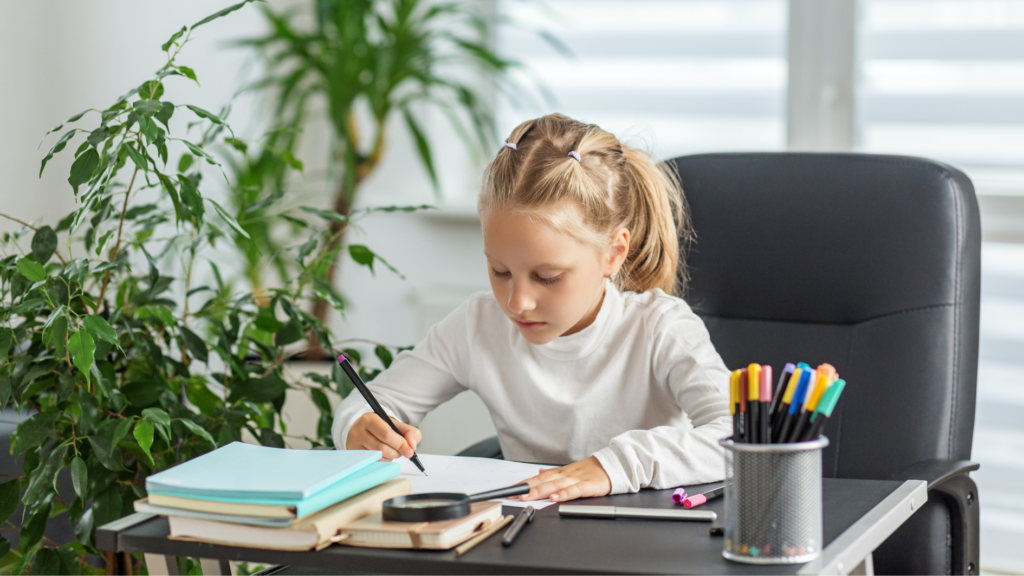 Focused School Girl Doing Homeschool Lesson at Desk 